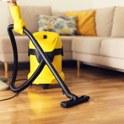 woman-cleaning-sofa-with-yellow-vacuum-cleaner-copy-space-cleaning-service-concept.jpg